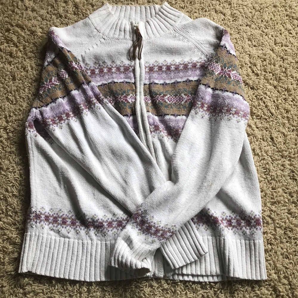 Zip up turtleneck sweatshirt.